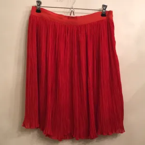 Orange pleated skirt